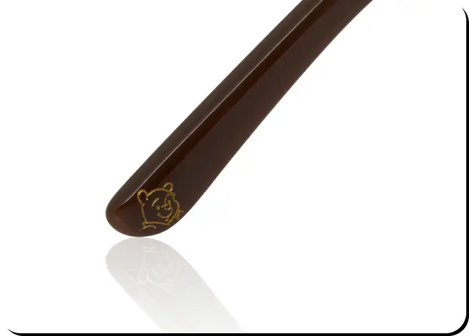 Features a signature Winnie the Pooh and sun motif at the temple tips.